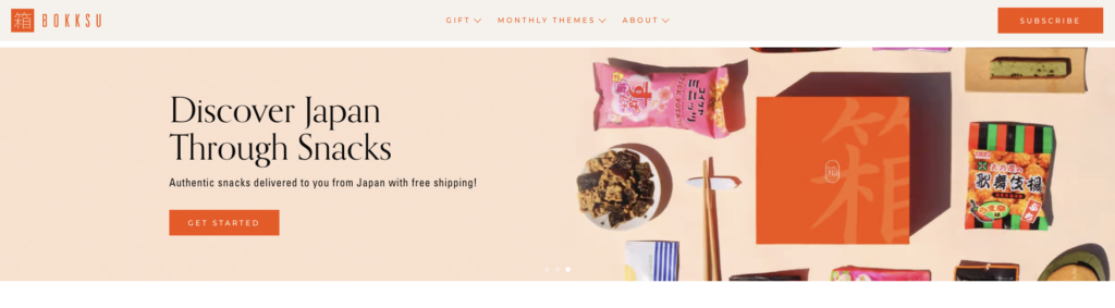Homepage snapshot of Bokksu's—an ecommerce subscription business— website as shown by a snapshot of their snack boxes.