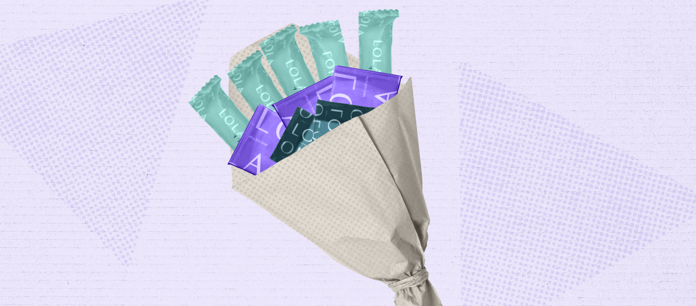 Image shows tampons and other period care products arranged in a bouquet, like flowers.