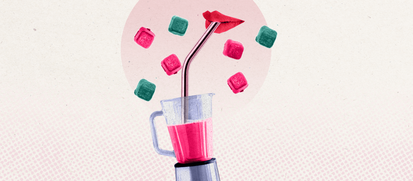 A blender with a straw sticking out of the top with colorful smoothie cubes raining down around it in celebration