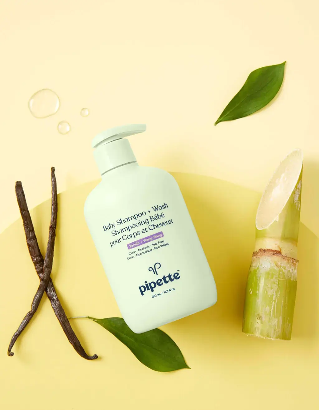 A topdown shot from Pipette's About Us page showing a pale green bottle of their baby shampoo and wash product