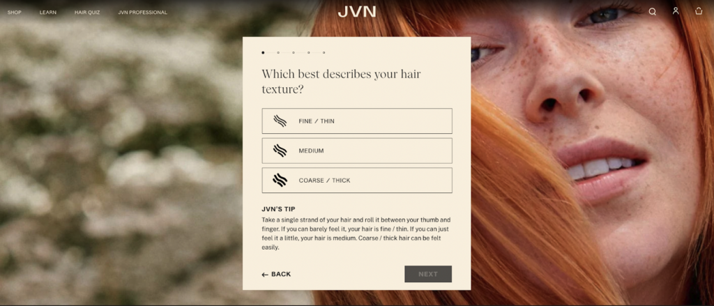 A screenshot of JVN Hair's website. The background is a close-up red-haired woman. Overlayed, is a pop out box with a hair quiz.