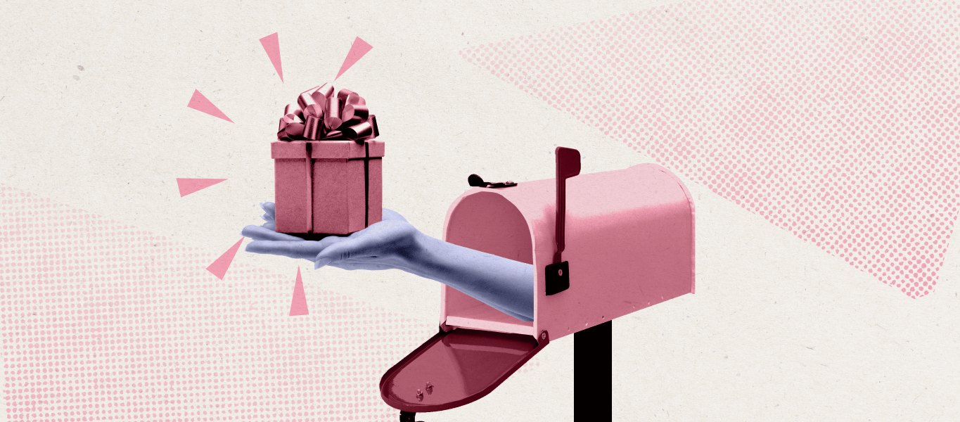 A hand popping out of a mailbox holding a wrapped gift