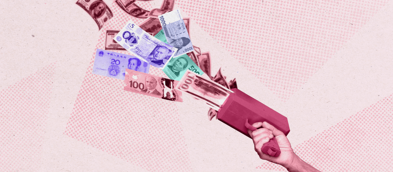 A money gun with multiple currencies shooting out of it
